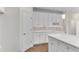 Kitchen featuring white cabinetry, subway tile backsplash and a center island at 1900 Sanborne Way, Dacula, GA 30019