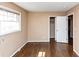 Cozy bedroom featuring hardwood floors, closet, and a window allowing natural light at 2458 Kelly Lake Dr, Decatur, GA 30032