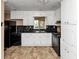 Traditional-style kitchen with white cabinets, black marble countertops, and stainless steel appliances at 2458 Kelly Lake Dr, Decatur, GA 30032