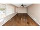 Living room showcasing hardwood floors, abundant natural light, and a ceiling fan at 2458 Kelly Lake Dr, Decatur, GA 30032