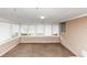 Sunroom with tan brick accent wall and a wall of windows overlooking the yard at 2458 Kelly Lake Dr, Decatur, GA 30032