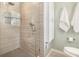 Tile shower with glass door and built-in shelves in newly renovated bathroom at 2781 Hollywood Dr, Decatur, GA 30033