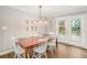 Bright dining room features hardwood floors and french doors opening to outdoor deck at 2781 Hollywood Dr, Decatur, GA 30033