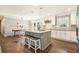 Kitchen island features bar stool seating, pendant lights, stone countertops, and stainless steel appliances at 2781 Hollywood Dr, Decatur, GA 30033