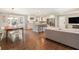 Open-concept living room flows into kitchen with a hardwood floor and a neutral color palette at 2781 Hollywood Dr, Decatur, GA 30033