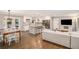 Open-concept living room flows into kitchen with a hardwood floor and a neutral color palette at 2781 Hollywood Dr, Decatur, GA 30033