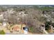 Distant aerial view of the property with a private driveway, manicured lawn, and storage shed at 2905 Ivy Mill Drive Dr, Buford, GA 30519