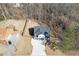 Aerial view of the home featuring a backyard shed and a long private driveway at 2905 Ivy Mill Drive Dr, Buford, GA 30519