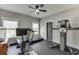 Bright exercise room with rubber flooring, ceiling fan, treadmill and weight machine at 2905 Ivy Mill Drive Dr, Buford, GA 30519