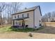 Back exterior of home featuring covered patio, yard, and wooden fence at 2905 Ivy Mill Drive Dr, Buford, GA 30519