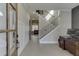 Bright foyer with staircase, desk, and wood-paneled accent wall at 2905 Ivy Mill Drive Dr, Buford, GA 30519