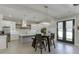 Well-lit kitchen featuring stainless steel appliances, a large island, and adjacent dining area at 2905 Ivy Mill Drive Dr, Buford, GA 30519