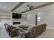 Bright living room with wood beam ceiling accents, fireplace, built-ins, and comfortable seating at 2905 Ivy Mill Drive Dr, Buford, GA 30519