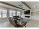 Comfortable living room with wooden beam accents, fireplace, and bright windows at 2905 Ivy Mill Drive Dr, Buford, GA 30519