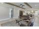 Open-concept living room and kitchen area featuring wood beam ceiling accents at 2905 Ivy Mill Drive Dr, Buford, GA 30519