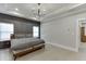 This main bedroom features a tray ceiling with modern chandelier and large windows at 2905 Ivy Mill Drive Dr, Buford, GA 30519