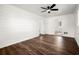 This spacious bedroom is illuminated by a modern ceiling fan and features natural light with beautiful hardwood floors at 35 Adair Dr, Marietta, GA 30066