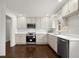 Modern kitchen with stainless steel appliances, white countertops, and bright white cabinets and backsplash at 35 Adair Dr, Marietta, GA 30066