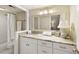 Bright bathroom featuring a granite countertop, white cabinets, and a shower with a curtain at 168 Maribeau Nw Sq, Atlanta, GA 30327