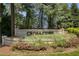 Stone community entrance sign for Cross Creek surrounded by flowers and landscaping at 168 Maribeau Nw Sq, Atlanta, GA 30327