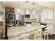 Bright kitchen features stainless appliances, stacked washer and dryer, and a marble countertop island with seating at 168 Maribeau Nw Sq, Atlanta, GA 30327