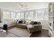 Light-filled sunroom with multiple windows, comfortable seating, and a view of the outdoors at 168 Maribeau Nw Sq, Atlanta, GA 30327