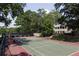 Well-maintained tennis court surrounded by lush trees at 168 Maribeau Nw Sq, Atlanta, GA 30327