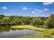 Breathtaking view of the calm lake surrounded by lush trees at 168 Maribeau Nw Sq, Atlanta, GA 30327