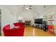 Cozy living room featuring a fireplace, vaulted ceiling, and hardwood floors at 1710 River Mill Ne Trl, Conyers, GA 30012