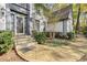 Charming front entrance with brick walkway and steps, leading to a stylish home at 2680 Spalding Dr, Sandy Springs, GA 30350