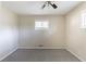 Bedroom features neutral walls, window, ceiling fan and gray carpet at 3651 Tulip Dr, Decatur, GA 30032