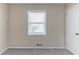 Cozy bedroom with a window and neutral carpet, perfect for relaxation at 3651 Tulip Dr, Decatur, GA 30032