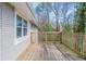 Wooden deck featuring wooden railings, ideal for outdoor relaxation and overlooking the natural surroundings at 3651 Tulip Dr, Decatur, GA 30032