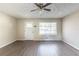 Neutral living room features wood floors, ceiling fan, and a front entry door at 3651 Tulip Dr, Decatur, GA 30032