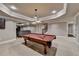 Spacious finished basement with a pool table, recessed lighting, and access to other living areas at 370 Laurel Oak Dr, Suwanee, GA 30024