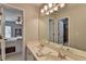 Bathroom features double sinks and a view to the bedroom, toilet and tiled shower/tub combination at 370 Laurel Oak Dr, Suwanee, GA 30024