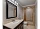 Elegant bathroom with a stone-tiled shower and vanity at 370 Laurel Oak Dr, Suwanee, GA 30024