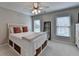 Bedroom with two windows and a bed with storage underneath and closet at 370 Laurel Oak Dr, Suwanee, GA 30024