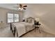 Bright bedroom features a ceiling fan, neutral walls, carpet and a window providing lots of natural light at 370 Laurel Oak Dr, Suwanee, GA 30024