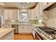 Well-lit kitchen with stainless steel appliances and a large window at 370 Laurel Oak Dr, Suwanee, GA 30024