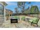 Stone patio with outdoor seating, perfect for entertaining or relaxing at 370 Laurel Oak Dr, Suwanee, GA 30024