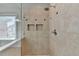 Walk-in shower with glass enclosure and built in shelf at 370 Laurel Oak Dr, Suwanee, GA 30024