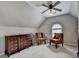 Sitting room featuring vaulted ceilings, accent chairs, and natural light at 370 Laurel Oak Dr, Suwanee, GA 30024