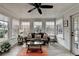 Cozy sunroom with ample natural light and comfortable seating at 370 Laurel Oak Dr, Suwanee, GA 30024