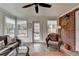 Bright sunroom with stylish seating and a view of the outdoors at 370 Laurel Oak Dr, Suwanee, GA 30024