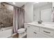 Bathroom featuring a shower-tub combination with a decorative shower curtain, neutral walls, and tile floors at 48 Lantern Trce, Hiram, GA 30141