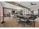 Spacious common room featuring wood flooring, exposed beams, and a cozy fireplace in the background at 48 Lantern Trce, Hiram, GA 30141