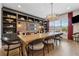 Elegant dining room with a large wooden table, stylish seating, and chic light fixture at 48 Lantern Trce, Hiram, GA 30141