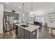 Spacious kitchen featuring an island with granite countertops and stainless steel appliances at 48 Lantern Trce, Hiram, GA 30141