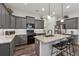 Beautiful kitchen with gray cabinets, granite countertops, an island, and stainless steel appliances at 48 Lantern Trce, Hiram, GA 30141